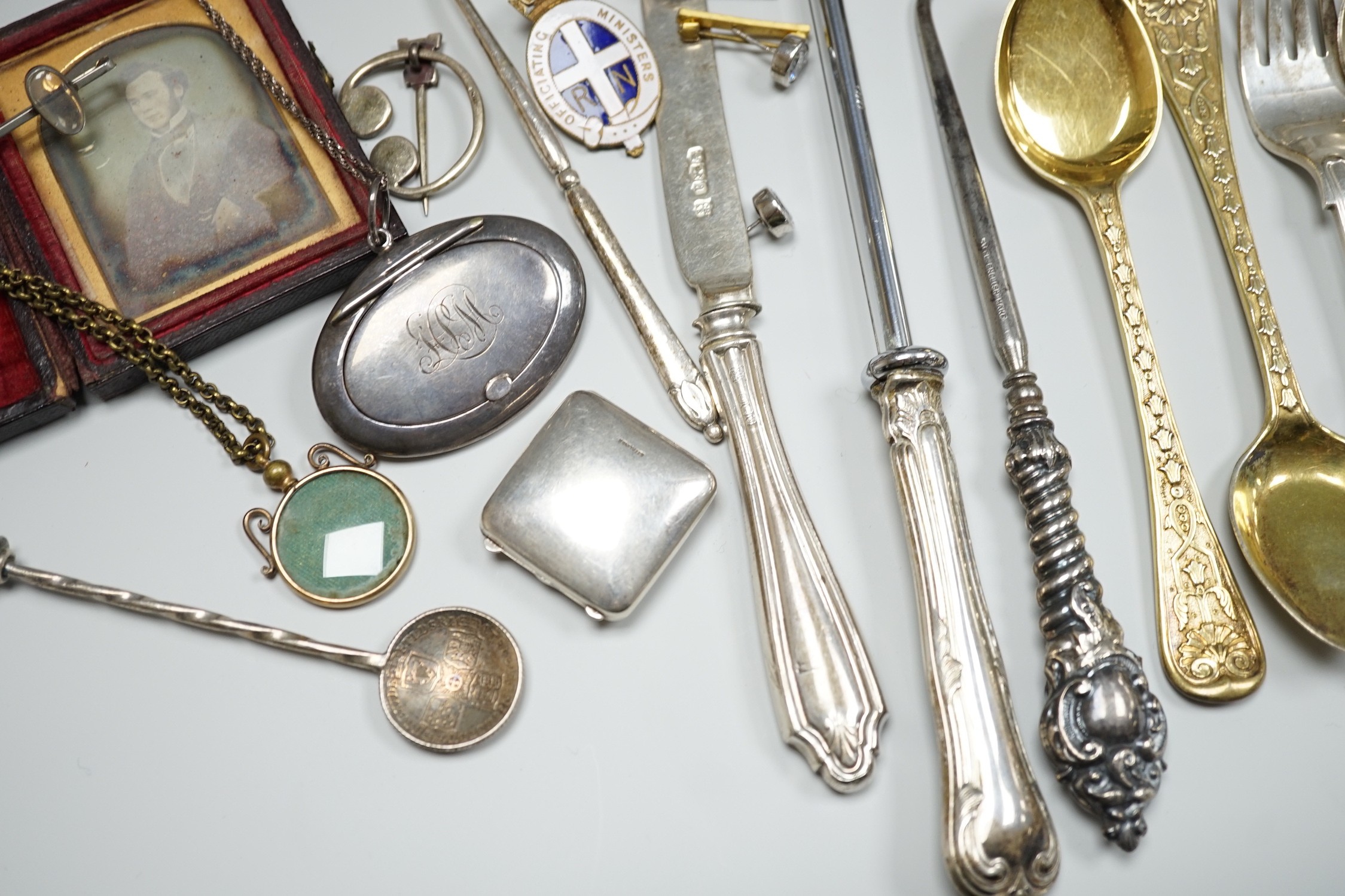 Sundry small silver including two sauceboats, napkin rings, mounted glass condiment bottle, pepperette, pair of silver gilt preserve spoons, minor flatware including white metal, a 1920's Georg Jensen silver cream ladle,
